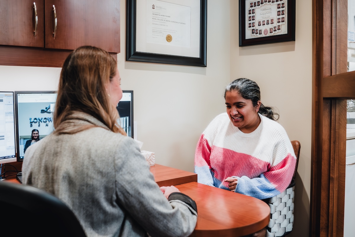 Patient sitting at the computer with our treatment coordinator